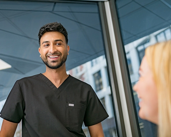 image of a treatment coordinator with a patient, for dental implants. Manchester City Centre Dental & Implant Clinic